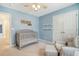 Charming Bedroom featuring a gray crib, a comfortable chair, and soft carpeting at 9995 Winged Elm St, Ladson, SC 29456