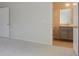 View of a bathroom with a vanity and gray cabinets from a bedroom at 103 Moscato Ln, Summerville, SC 29485
