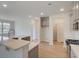 Spacious kitchen features a large island with quartz countertop and stainless appliances at 103 Moscato Ln, Summerville, SC 29485