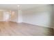 Open-concept living room with wood floors, natural light and neutral paint at 103 Moscato Ln, Summerville, SC 29485