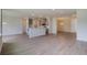 Spacious open-concept floor plan featuring updated fixtures and gray cabinets in kitchen at 103 Moscato Ln, Summerville, SC 29485