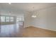 Open-concept living room featuring luxury vinyl plank flooring and ample natural light at 103 Moscato Ln, Summerville, SC 29485
