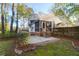 Well-maintained backyard featuring a screened porch, brick patio, and lush landscaping at 109 Nelson Ct, Summerville, SC 29485