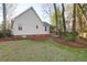 Side view of the house, showing a well-maintained lawn and mature trees at 109 Nelson Ct, Summerville, SC 29485
