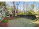 Expansive backyard with a lush lawn, flowering plants, and a privacy fence at 109 Nelson Ct, Summerville, SC 29485