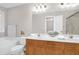 Bright bathroom offers a double sink vanity, soaking tub, and separate shower area at 109 Nelson Ct, Summerville, SC 29485