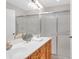 Bright bathroom features double sinks, vanity, a glass-enclosed shower, and contemporary lighting at 109 Nelson Ct, Summerville, SC 29485