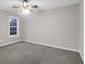 This bedroom features a ceiling fan, neutral walls and carpet, plus a bright window at 109 Nelson Ct, Summerville, SC 29485