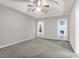 This spacious bedroom features two bright windows, a ceiling fan, and soft neutral colored walls at 109 Nelson Ct, Summerville, SC 29485
