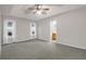 This spacious bedroom has a ceiling fan and access to the bathroom, neutral walls and bright windows at 109 Nelson Ct, Summerville, SC 29485