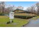 Community clubhouse with green trim and a matching green NP logo, plus landscaped grounds at 109 Nelson Ct, Summerville, SC 29485