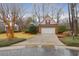 Attractive brick home with manicured lawn, driveway, and an attached two-car garage at 109 Nelson Ct, Summerville, SC 29485