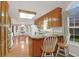 The bright kitchen features a breakfast nook, wood cabinets and hardwood floors at 109 Nelson Ct, Summerville, SC 29485