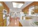 The eat-in kitchen is bathed in natural light and features wood cabinets at 109 Nelson Ct, Summerville, SC 29485