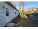 Side yard with a door, landscaping, and fenced yard provides privacy at 109 Nelson Ct, Summerville, SC 29485