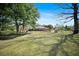 Large backyard with mature trees, partially fenced, and lots of room for outdoor activities at 1115 O T Wallace Blvd, Moncks Corner, SC 29461