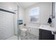 Modern bathroom with a glass shower, patterned tile floor, and a vanity at 1115 O T Wallace Blvd, Moncks Corner, SC 29461