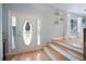 Bright foyer featuring a decorative glass front door, hardwood floors and interior decor at 1115 O T Wallace Blvd, Moncks Corner, SC 29461
