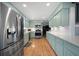 Stylish kitchen featuring stainless steel appliances and beautiful white countertop, accented by light cabinets at 1115 O T Wallace Blvd, Moncks Corner, SC 29461