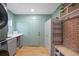Well-organized laundry room with cabinets, a sink, and modern appliances at 1115 O T Wallace Blvd, Moncks Corner, SC 29461