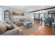 Cozy living room merges seamlessly with the dining area, highlighted by hardwood floors and comfortable seating at 1115 O T Wallace Blvd, Moncks Corner, SC 29461