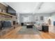Spacious living room with a fireplace, built-in shelves, and lots of natural light at 1115 O T Wallace Blvd, Moncks Corner, SC 29461