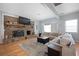 Cozy living room with a large brick fireplace and a comfortable couch at 1115 O T Wallace Blvd, Moncks Corner, SC 29461