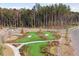 Aerial view of an attractive putting green, set among walking paths and landscaping at 1156 Darling St, Summerville, SC 29485