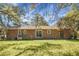 Expansive backyard featuring a well-maintained lawn and a brick home exterior at 113 Harter Dr, Summerville, SC 29485