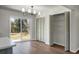 Bright dining area featuring wood floors, modern chandelier, and sliding glass doors to the backyard at 113 Harter Dr, Summerville, SC 29485