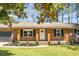 Inviting front porch with brick columns and manicured landscaping at 113 Harter Dr, Summerville, SC 29485