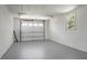 Clean, empty garage with a white door, a window, and a gray painted floor at 113 Harter Dr, Summerville, SC 29485
