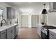 Updated kitchen with gray cabinetry, stainless steel appliances and modern sink at 113 Harter Dr, Summerville, SC 29485