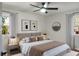 Bedroom featuring neutral walls, a ceiling fan, and windows dressed with curtains at 113 Harter Dr, Summerville, SC 29485