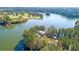 Stunning aerial view of property showcasing lakefront views, lush greenery, and charming venue at 114 Moscato Ln, Summerville, SC 29485