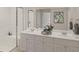 Elegant bathroom with double vanity, marble countertop, shower, and stylish fixtures offers a luxurious experience at 114 Moscato Ln, Summerville, SC 29485