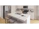Modern kitchen featuring a large island with a sink, stainless steel appliances, and pendant lighting at 114 Moscato Ln, Summerville, SC 29485