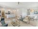 Open-concept living room with modern furnishings, connecting to the kitchen and dining area at 117 Moscato Ln, Summerville, SC 29485