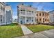 Beautiful two-story home with a welcoming front porch and well-maintained landscaping at 121 Cantona Dr, Summerville, SC 29483