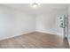 Spacious bedroom with wood floors, neutral walls, and natural light from the large windows at 126 Cantona Dr, Summerville, SC 29483