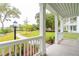 Covered front porch with a view of a scenic community park and pond at 126 Cantona Dr, Summerville, SC 29483