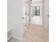 Hallway features beautiful herringbone wood flooring, built in shelving, and natural light from the exterior doors at 126 Cantona Dr, Summerville, SC 29483