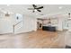 Spacious living area with hardwood floors, seamlessly connected to the kitchen and staircase at 126 Cantona Dr, Summerville, SC 29483