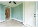 Cozy porch with light green siding, ceiling fan and view into the home at 126 Cantona Dr, Summerville, SC 29483