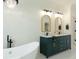 Luxurious bathroom boasting a soaking tub, dual vanity, and modern fixtures at 1329 Wood Sorrel Dr, Moncks Corner, SC 29461