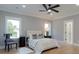 Bright bedroom featuring a ceiling fan, wood floors, and white trim at 1329 Wood Sorrel Dr, Moncks Corner, SC 29461