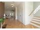 Bright foyer showcasing hardwood floors, access to the living space and stairs at 1329 Wood Sorrel Dr, Moncks Corner, SC 29461