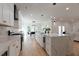 Open kitchen with marble countertops and stainless appliances, seamlessly blending with the living areas at 1329 Wood Sorrel Dr, Moncks Corner, SC 29461
