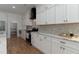 Well-equipped kitchen featuring white cabinetry, marble countertops, and modern appliances at 1329 Wood Sorrel Dr, Moncks Corner, SC 29461