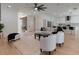 Open-concept living room with bright furniture and hardwood floors connects kitchen and other spaces at 1329 Wood Sorrel Dr, Moncks Corner, SC 29461